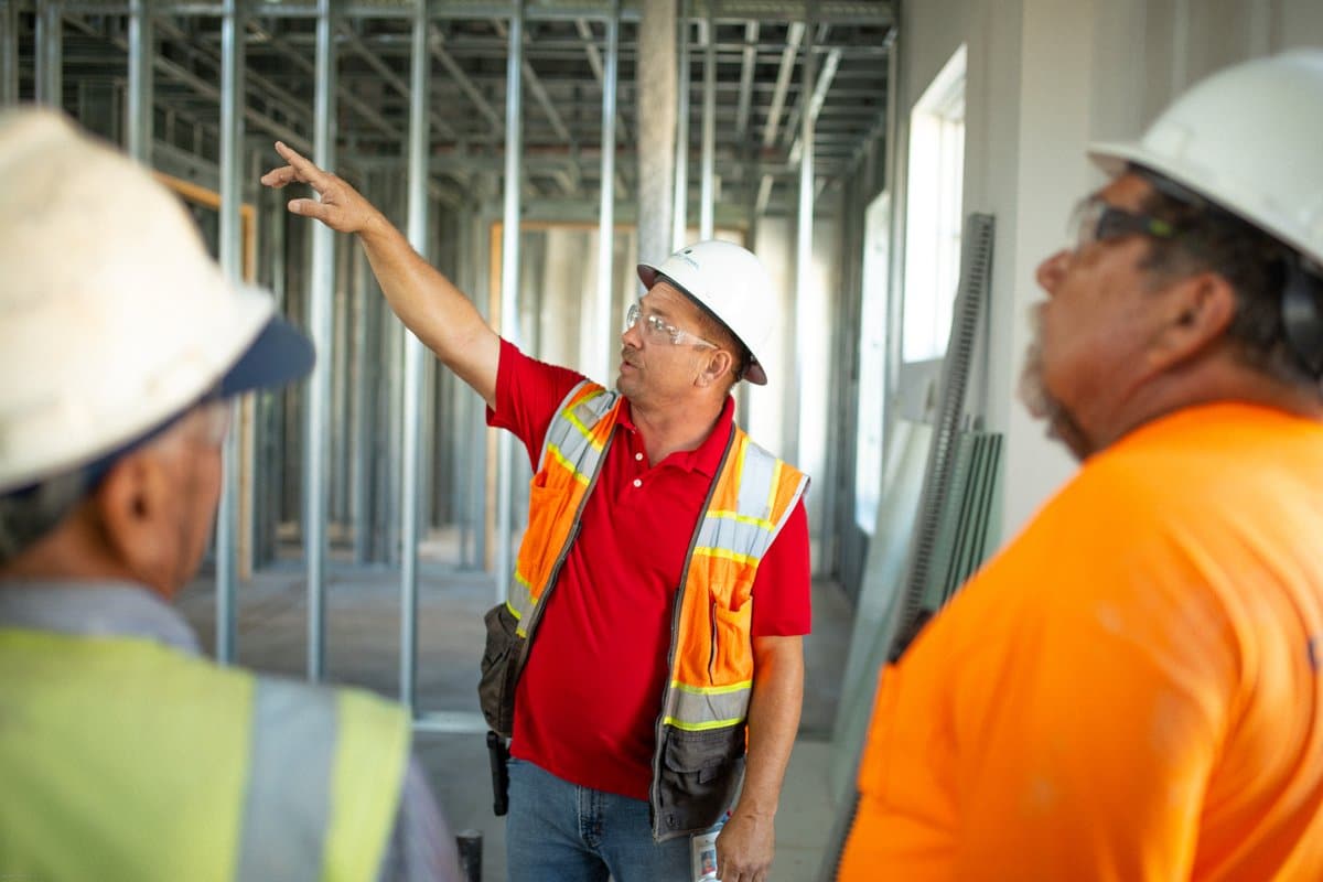 carroll daniel workers discussing project at construction site