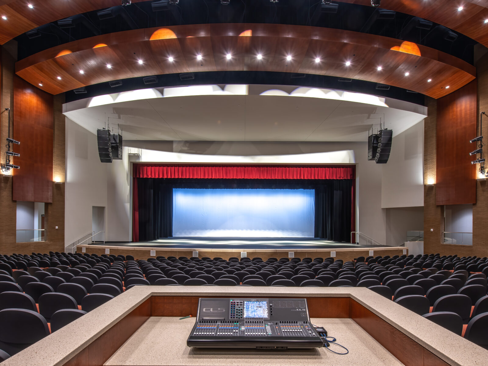 view looking at the stage from the sound board of forsyth county arts and learning center theater