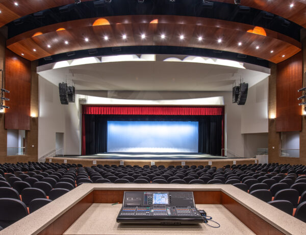 view looking at the stage from the sound board of forsyth county arts and learning center theater