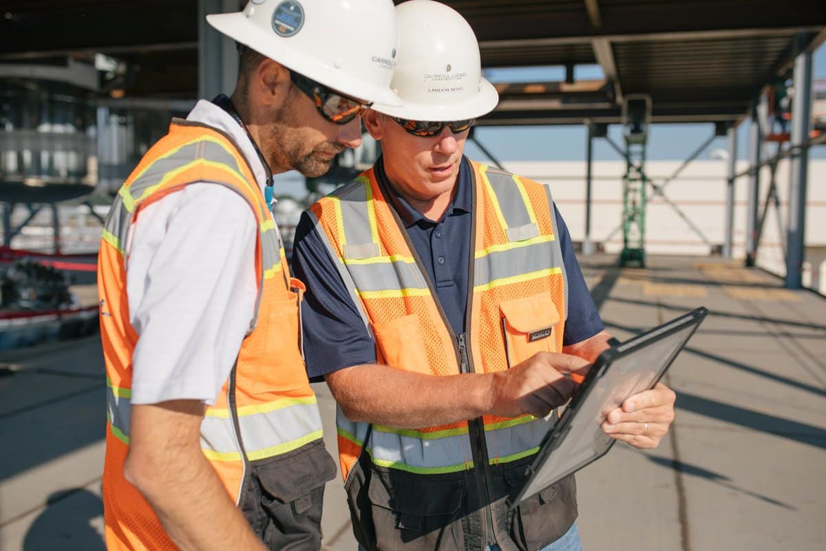 two carroll engineers talking at a construction site